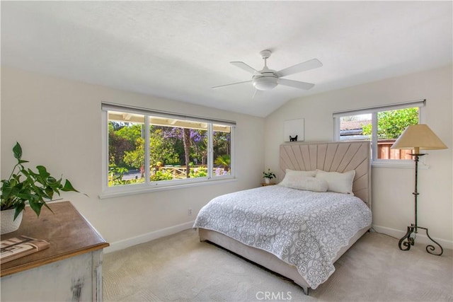 1212 Dover Dr, Newport Beach, CA 92660 - bedroom with light colored carpet, multiple windows, a ceiling fan, and vaulted ceiling
