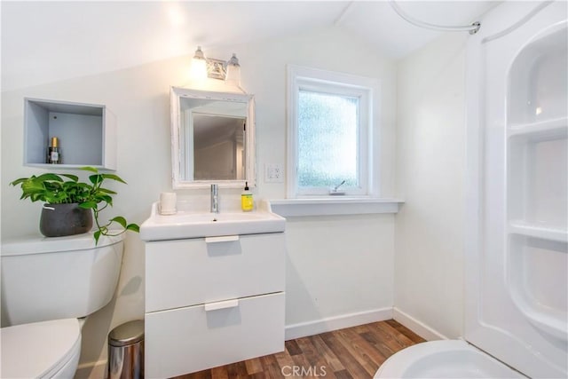 1212 Dover Dr, Newport Beach, CA 92660 - bathroom featuring vanity, wood finished floors, and vaulted ceiling