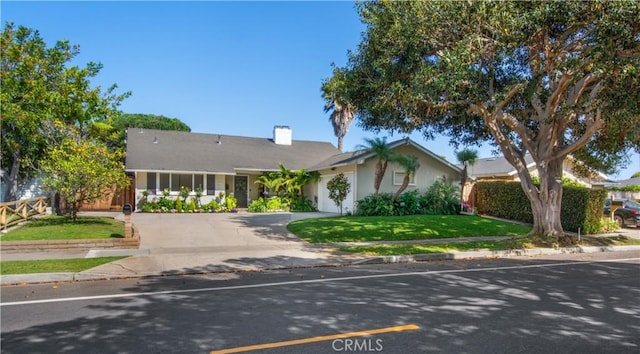 1212 Dover Dr, Newport Beach, CA 92660 - single story home with driveway, a garage, a front lawn, and a chimney