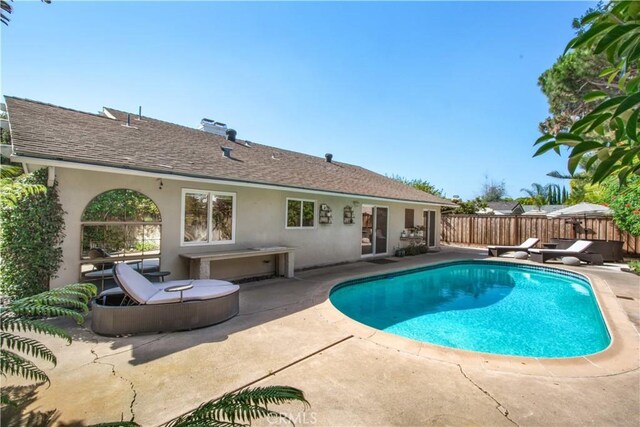 1212 Dover Dr, Newport Beach, CA 92660 - view of swimming pool with a patio
