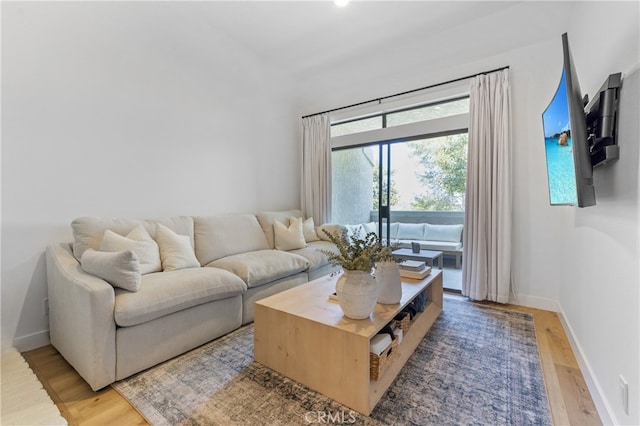 17202 Corbina Ln Unit 103, Huntington Beach, CA 92649 - living room featuring light wood-style floors and baseboards