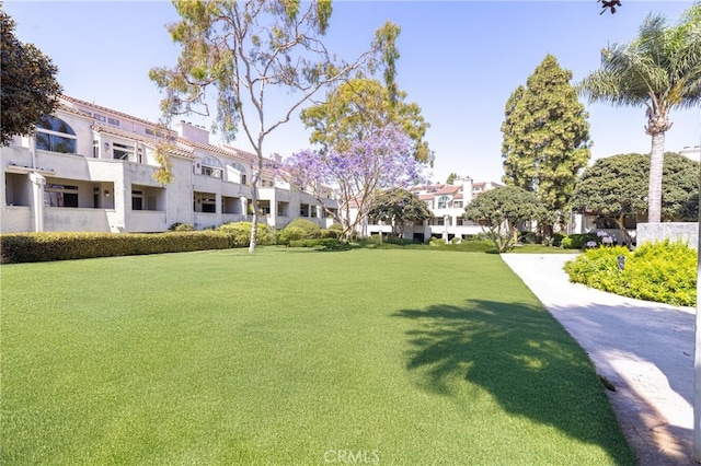 17202 Corbina Ln Unit 103, Huntington Beach, CA 92649 - view of property's community featuring a residential view and a lawn