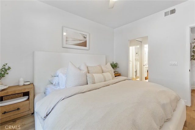 17202 Corbina Ln Unit 103, Huntington Beach, CA 92649 - bedroom featuring light wood finished floors, connected bathroom, and a ceiling fan