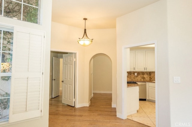 26604 Marigold Ct, Calabasas, CA 91302 - corridor featuring arched walkways and light wood-style flooring