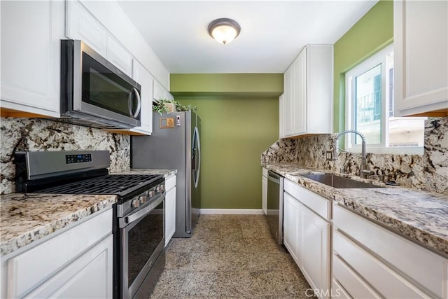 14947 Dickens St Unit 3, Sherman Oaks, CA 91403 - kitchen with appliances with stainless steel finishes, white cabinetry, decorative backsplash, and light stone counters