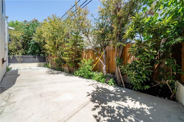 14947 Dickens St Unit 3, Sherman Oaks, CA 91403 - fenced backyard featuring a patio area and concrete driveway