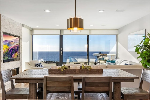 335 W I St, Encinitas, CA 92024 - dining area with wood finished floors and a wall of windows