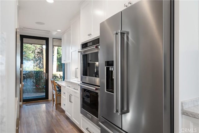 335 W I St, Encinitas, CA 92024 - kitchen featuring stainless steel appliances, white cabinetry, wood finished floors, light stone countertops, and recessed lighting