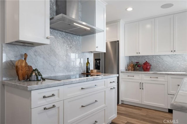 335 W I St, Encinitas, CA 92024 - kitchen featuring wall chimney range hood, black electric cooktop, decorative backsplash, white cabinetry, and recessed lighting