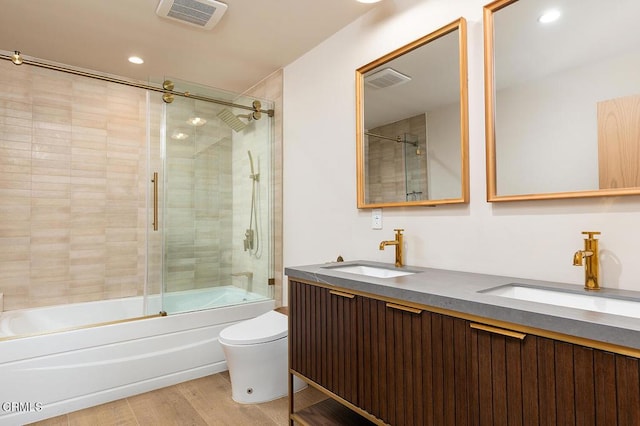 987 Bell St, Pasadena, CA 91104 - full bathroom featuring shower / bath combination with glass door, wood finished floors, double vanity, and recessed lighting