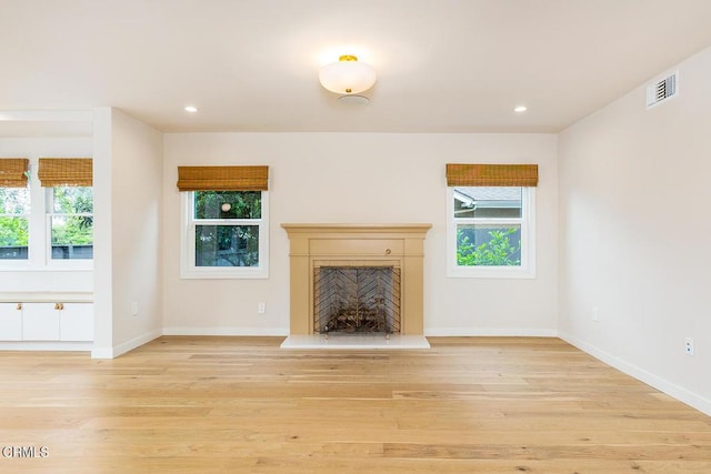 987 Bell St, Pasadena, CA 91104 - unfurnished living room with light wood-type flooring, plenty of natural light, a high end fireplace, and recessed lighting