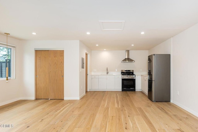 987 Bell St, Pasadena, CA 91104 - kitchen featuring appliances with stainless steel finishes, white cabinetry, light wood-type flooring, light countertops, and recessed lighting