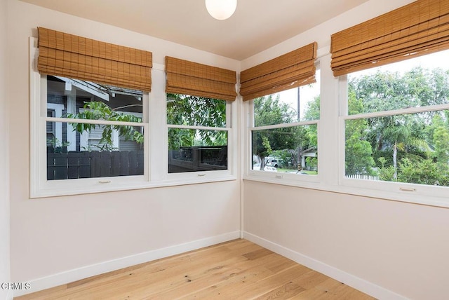 987 Bell St, Pasadena, CA 91104 - unfurnished sunroom with baseboards and wood finished floors