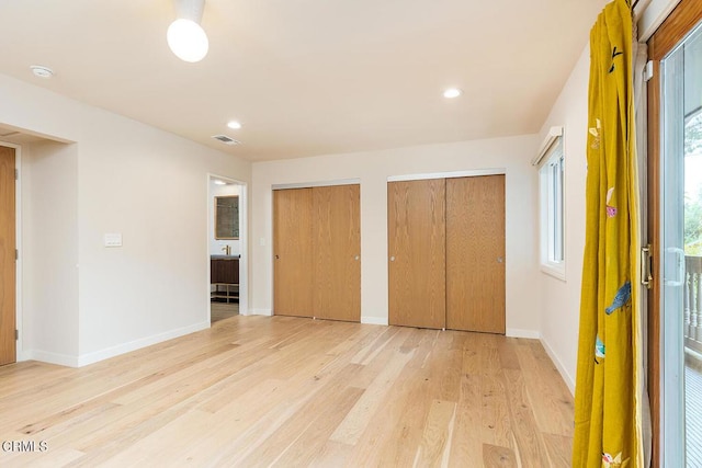987 Bell St, Pasadena, CA 91104 - unfurnished bedroom featuring multiple closets, light wood-type flooring, and recessed lighting