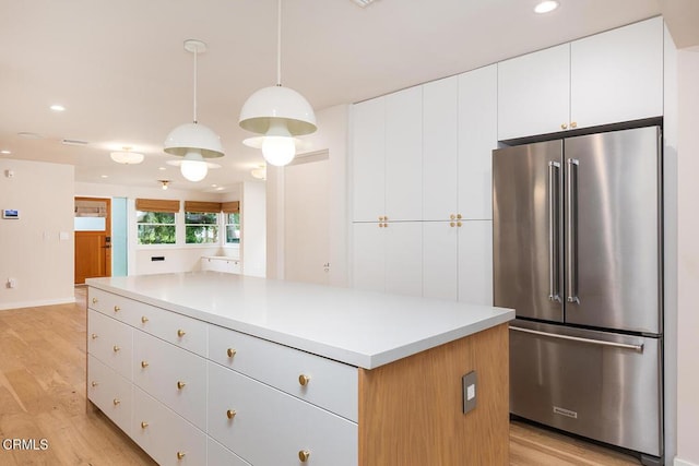 987 Bell St, Pasadena, CA 91104 - kitchen featuring high end fridge, light wood-style flooring, a kitchen island, white cabinetry, and recessed lighting