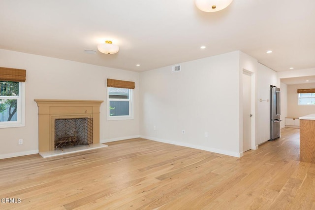 987 Bell St, Pasadena, CA 91104 - unfurnished living room with light wood-style flooring, recessed lighting, and a high end fireplace