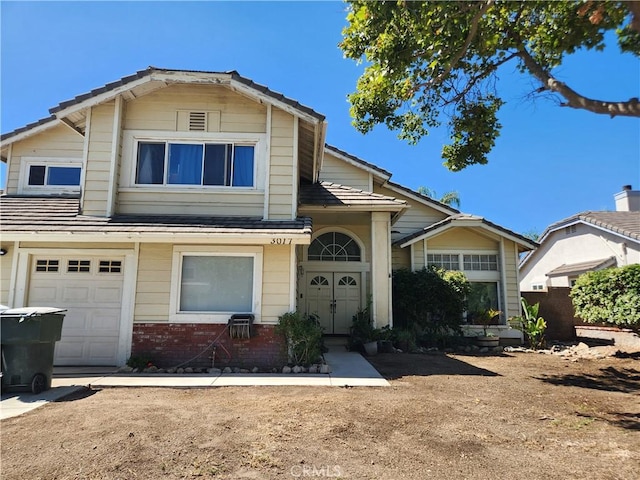3017 W Meyers Rd, San Bernardino, CA 92407 - view of front facade featuring brick siding and a garage