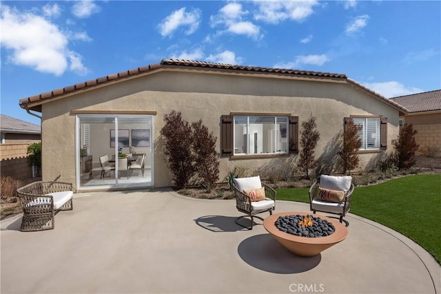 13902 Hidden Pines Ct, Victorville, CA 92392 - rear view of house featuring a patio, a fire pit, and stucco siding