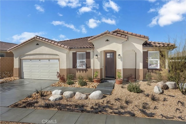 13902 Hidden Pines Ct, Victorville, CA 92392 - mediterranean / spanish home featuring a tile roof, a garage, driveway, and stucco siding