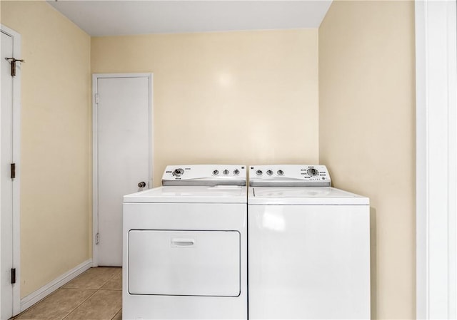 6116 Choctaw Dr, Westminster, CA 92683 - washroom featuring washing machine and dryer and light tile patterned flooring