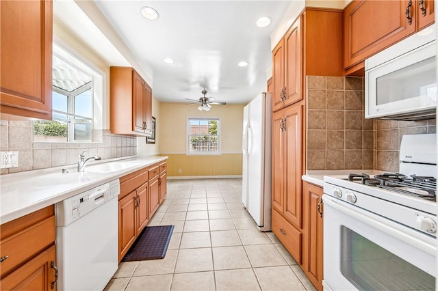 6116 Choctaw Dr, Westminster, CA 92683 - kitchen with white appliances, light countertops, light tile patterned floors, and recessed lighting