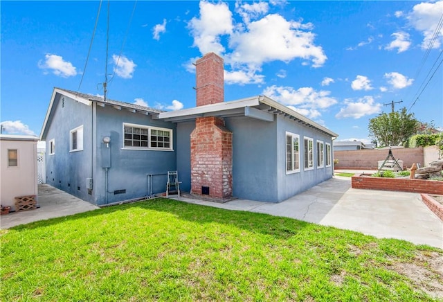 6116 Choctaw Dr, Westminster, CA 92683 - back of property featuring stucco siding, a chimney, and a patio area