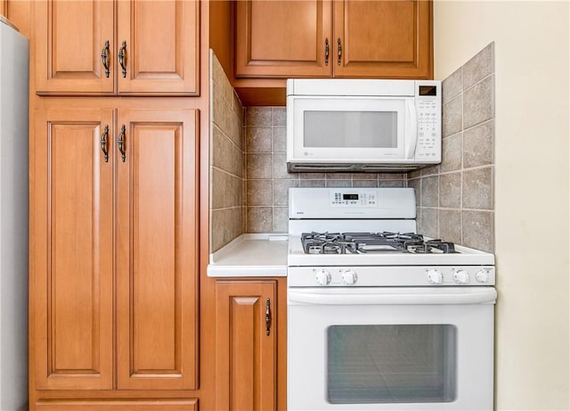 6116 Choctaw Dr, Westminster, CA 92683 - kitchen featuring white appliances, decorative backsplash, light countertops, and brown cabinetry