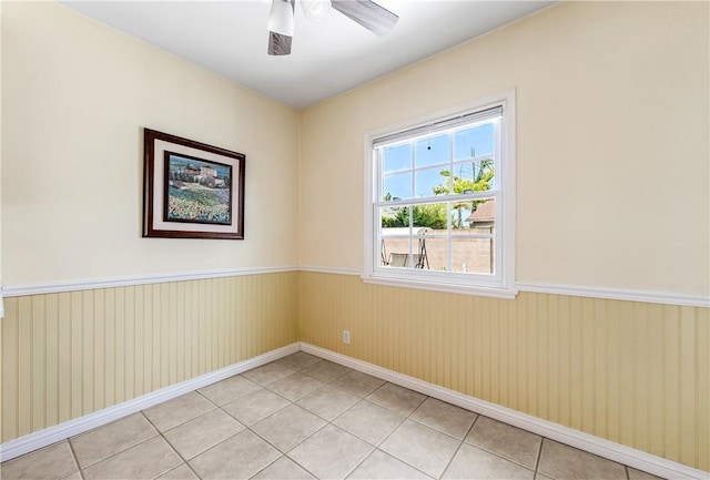 6116 Choctaw Dr, Westminster, CA 92683 - spare room with a wainscoted wall, ceiling fan, and light tile patterned floors