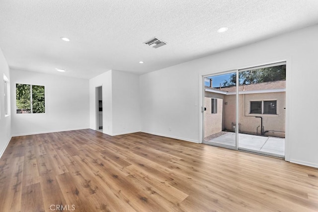 19147 Ingomar St, Reseda, CA 91335 - unfurnished room featuring a textured ceiling, light wood-style flooring, and recessed lighting