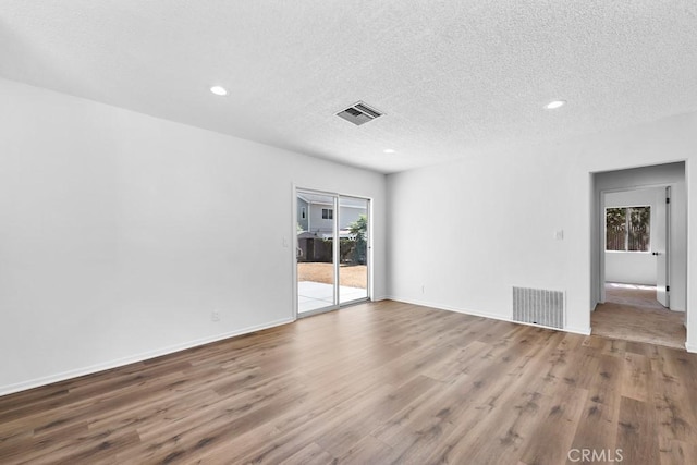 19147 Ingomar St, Reseda, CA 91335 - spare room with wood finished floors, plenty of natural light, recessed lighting, and a textured ceiling