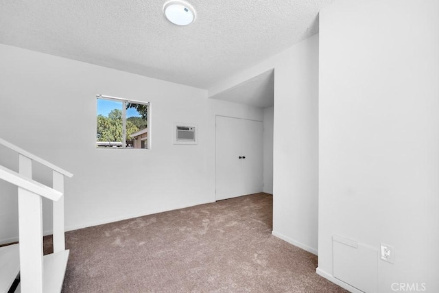 19147 Ingomar St, Reseda, CA 91335 - carpeted spare room with a textured ceiling and a wall unit AC