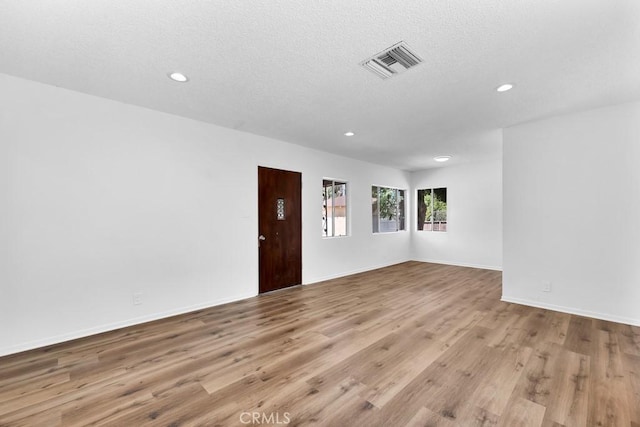 19147 Ingomar St, Reseda, CA 91335 - unfurnished room featuring recessed lighting, wood finished floors, and a textured ceiling