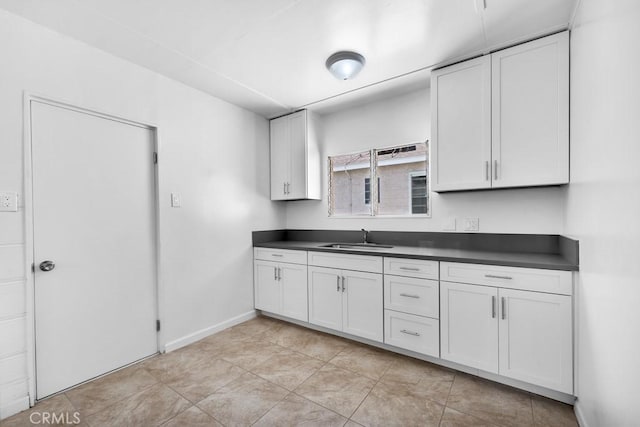 19147 Ingomar St, Reseda, CA 91335 - kitchen featuring dark countertops and white cabinets
