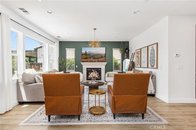 29443 Moorings Ct, Menifee, CA 92585 - living area featuring light wood-style flooring, a fireplace, and recessed lighting