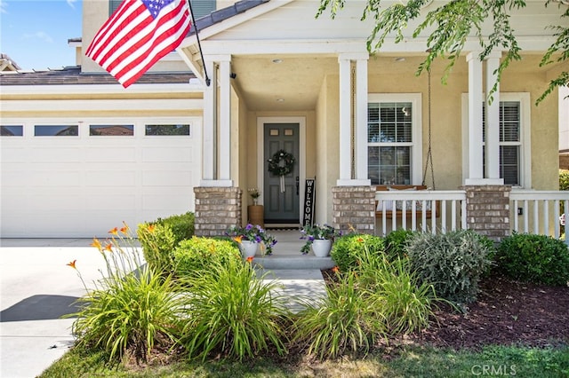 29443 Moorings Ct, Menifee, CA 92585 - property entrance with covered porch, an attached garage, driveway, and stucco siding
