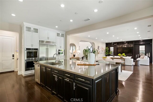 2282 E Rosecrans Ct, Brea, CA 92821 - kitchen featuring stainless steel appliances, white cabinetry, recessed lighting, open floor plan, and a large island