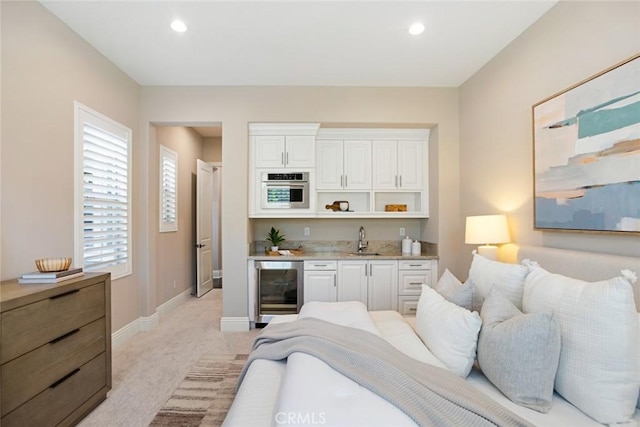 2282 E Rosecrans Ct, Brea, CA 92821 - bedroom with beverage cooler, light carpet, wet bar, and recessed lighting