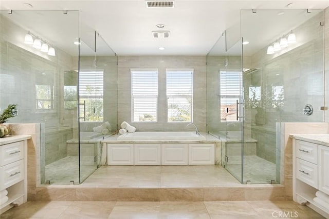 2282 E Rosecrans Ct, Brea, CA 92821 - full bathroom with vanity, a garden tub, a shower stall, plenty of natural light, and tile walls