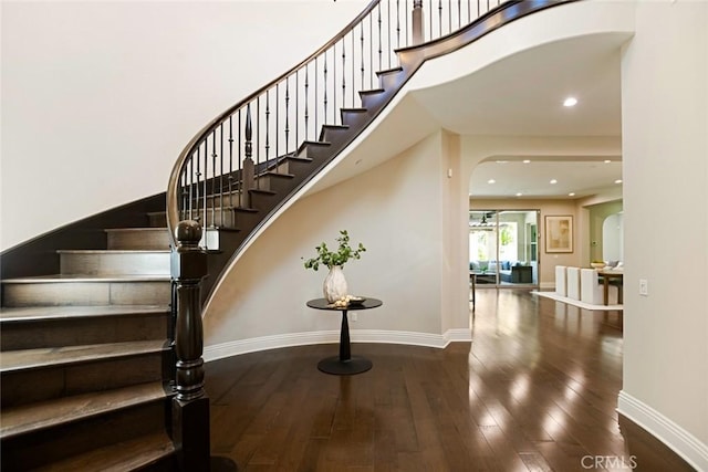 2282 E Rosecrans Ct, Brea, CA 92821 - staircase with hardwood / wood-style flooring, arched walkways, and recessed lighting