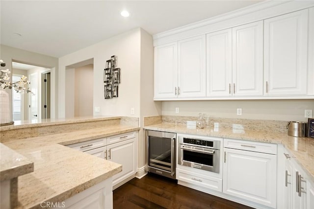2282 E Rosecrans Ct, Brea, CA 92821 - kitchen featuring wine cooler, stainless steel oven, white cabinetry, dark wood finished floors, and recessed lighting