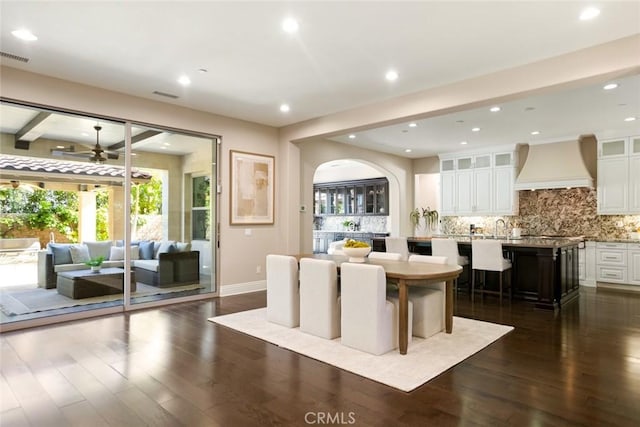 2282 E Rosecrans Ct, Brea, CA 92821 - dining area with arched walkways, a ceiling fan, dark wood finished floors, and recessed lighting