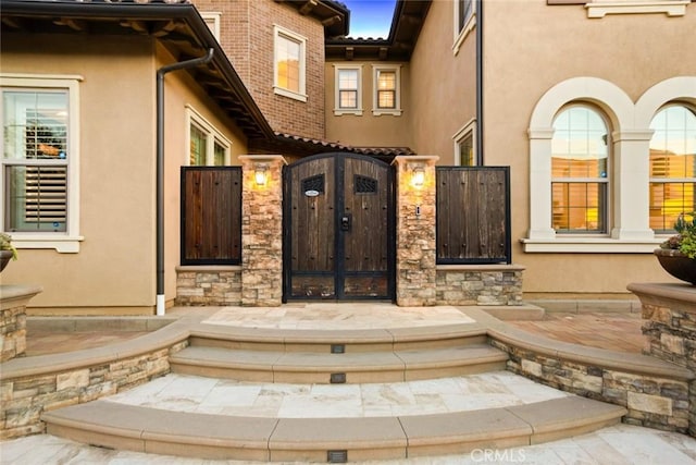 2282 E Rosecrans Ct, Brea, CA 92821 - doorway to property with stucco siding and a gate