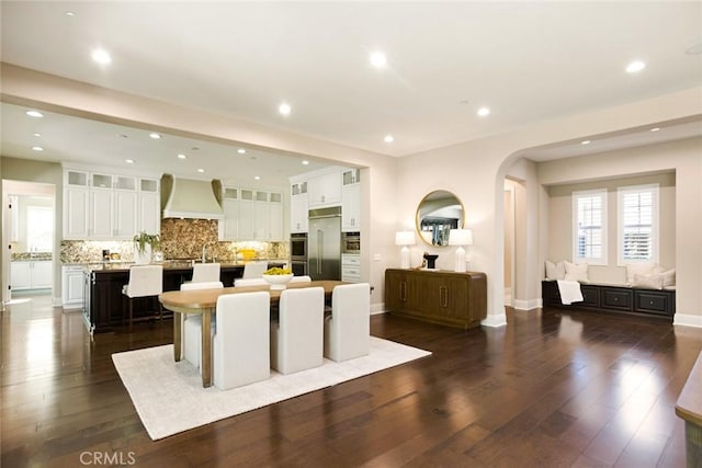 2282 E Rosecrans Ct, Brea, CA 92821 - dining space with arched walkways, dark wood-style flooring, and recessed lighting