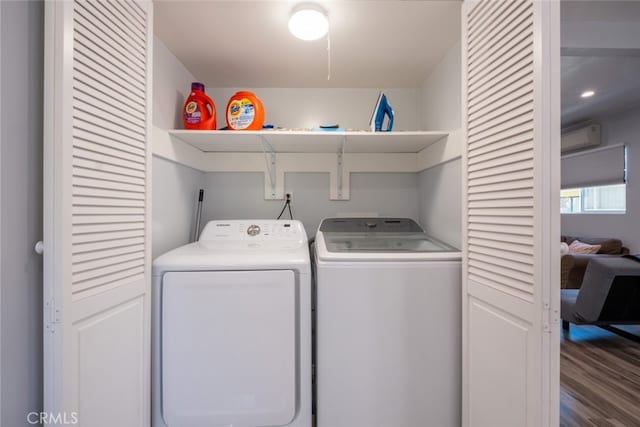 1741 Wabasso Way, Glendale, CA 91208 - laundry room featuring washing machine and dryer, a wall unit AC, and wood finished floors