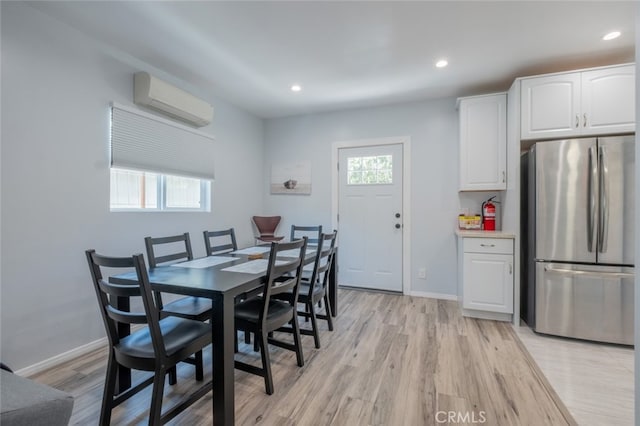 1741 Wabasso Way, Glendale, CA 91208 - dining area with a wall mounted air conditioner, light wood-style floors, and recessed lighting