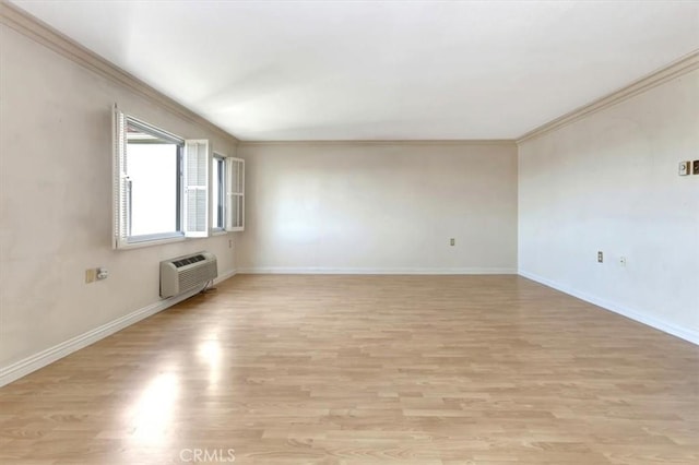 4001 Calle Sonora Unit 3E, Laguna Woods, CA 92637 - empty room featuring a wall mounted air conditioner, light wood finished floors, and ornamental molding