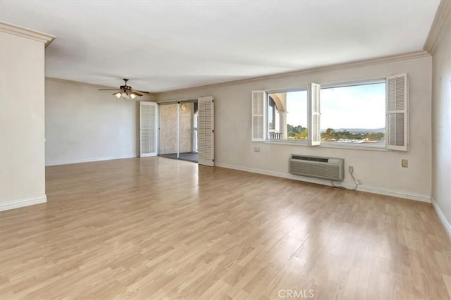 4001 Calle Sonora Unit 3E, Laguna Woods, CA 92637 - empty room featuring an AC wall unit, a ceiling fan, ornamental molding, and light wood-style floors