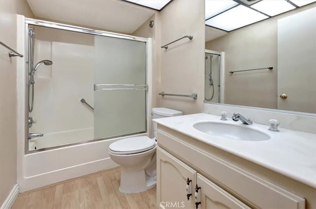 4001 Calle Sonora Unit 3E, Laguna Woods, CA 92637 - bathroom with wood finished floors, vanity, and enclosed tub / shower combo