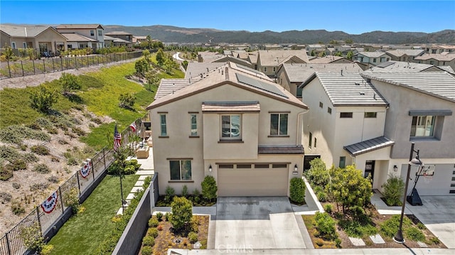 3372 Ivy Way, Rancho Mission Viejo, CA 92694 - view of front facade with a residential view, an attached garage, driveway, stucco siding, and a mountain view