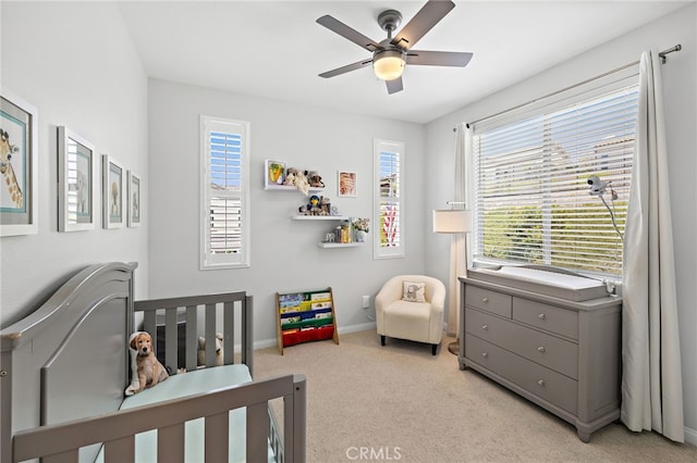 3372 Ivy Way, Rancho Mission Viejo, CA 92694 - bedroom featuring light colored carpet, ceiling fan, and a nursery area
